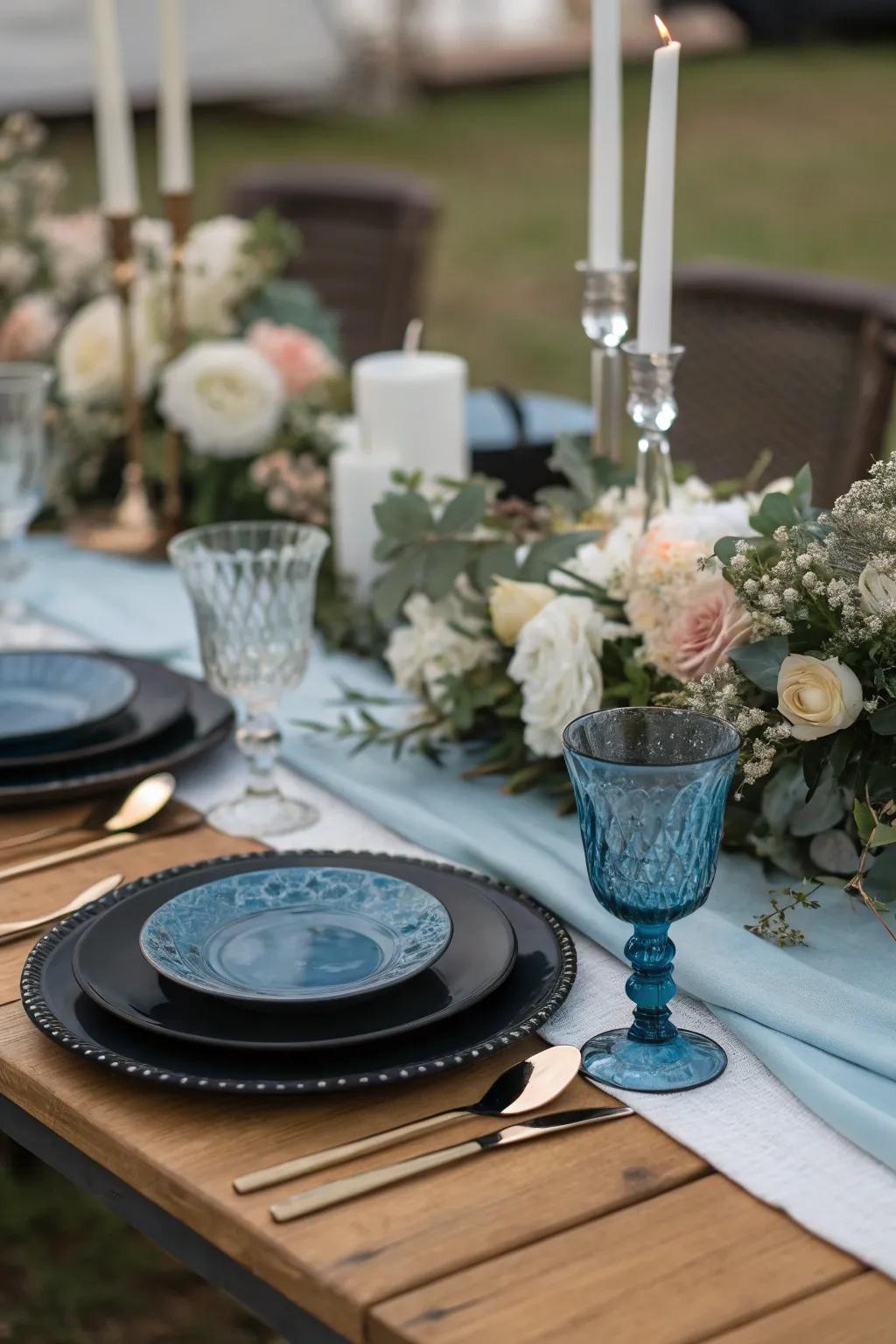 Elegant table settings in black and blue set the tone for a sophisticated celebration.