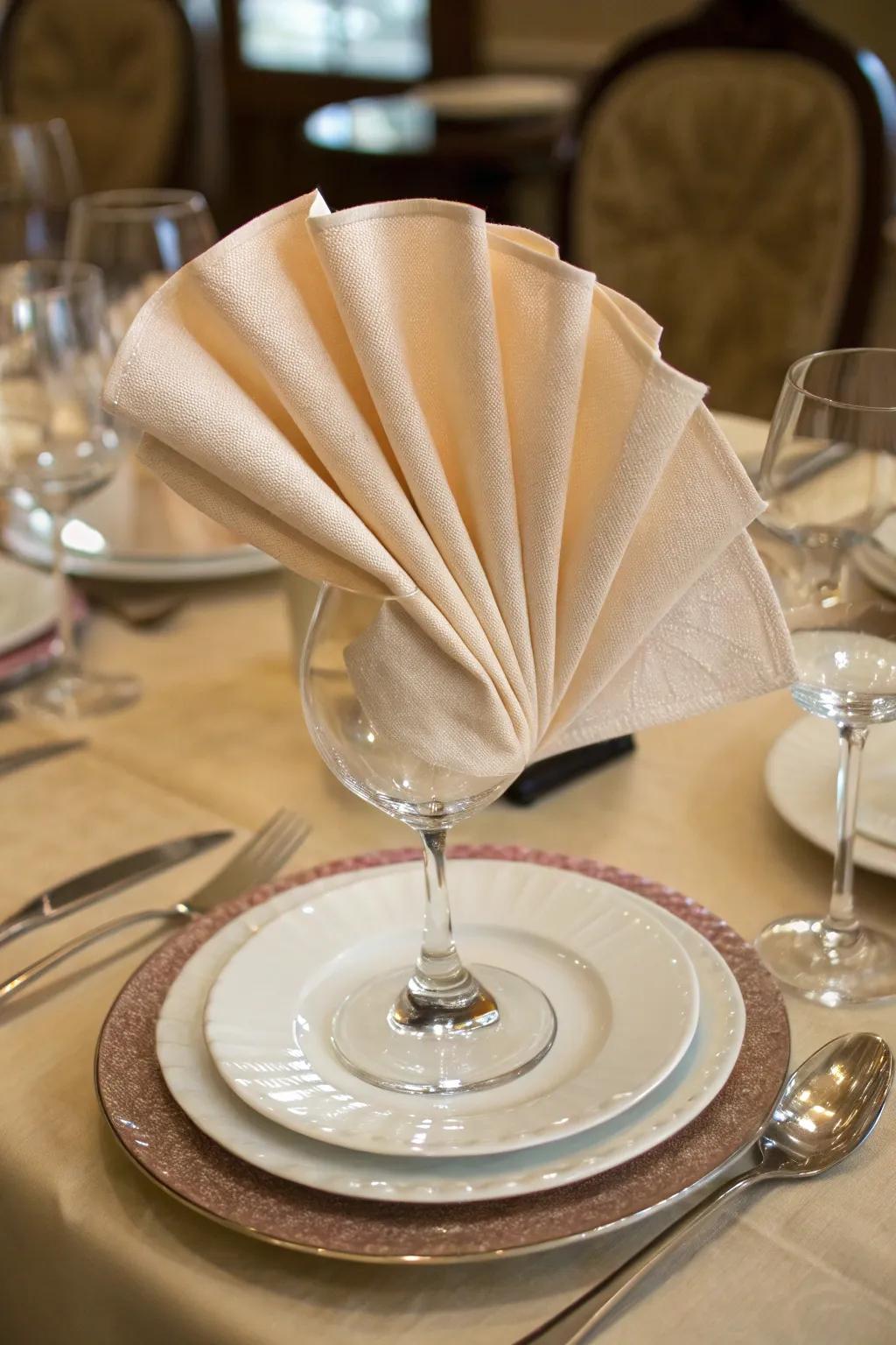 The classic fan napkin fold, perfect for any elegant occasion.