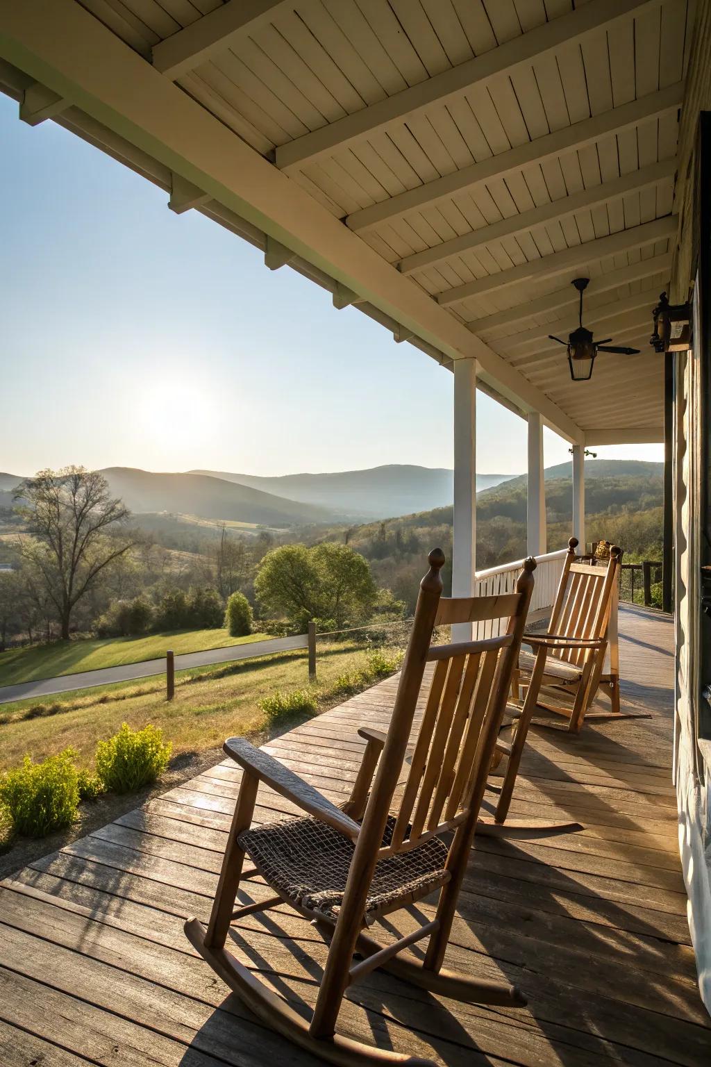 Classic wooden rocking chairs bathed in morning light on a country farmhouse porch.