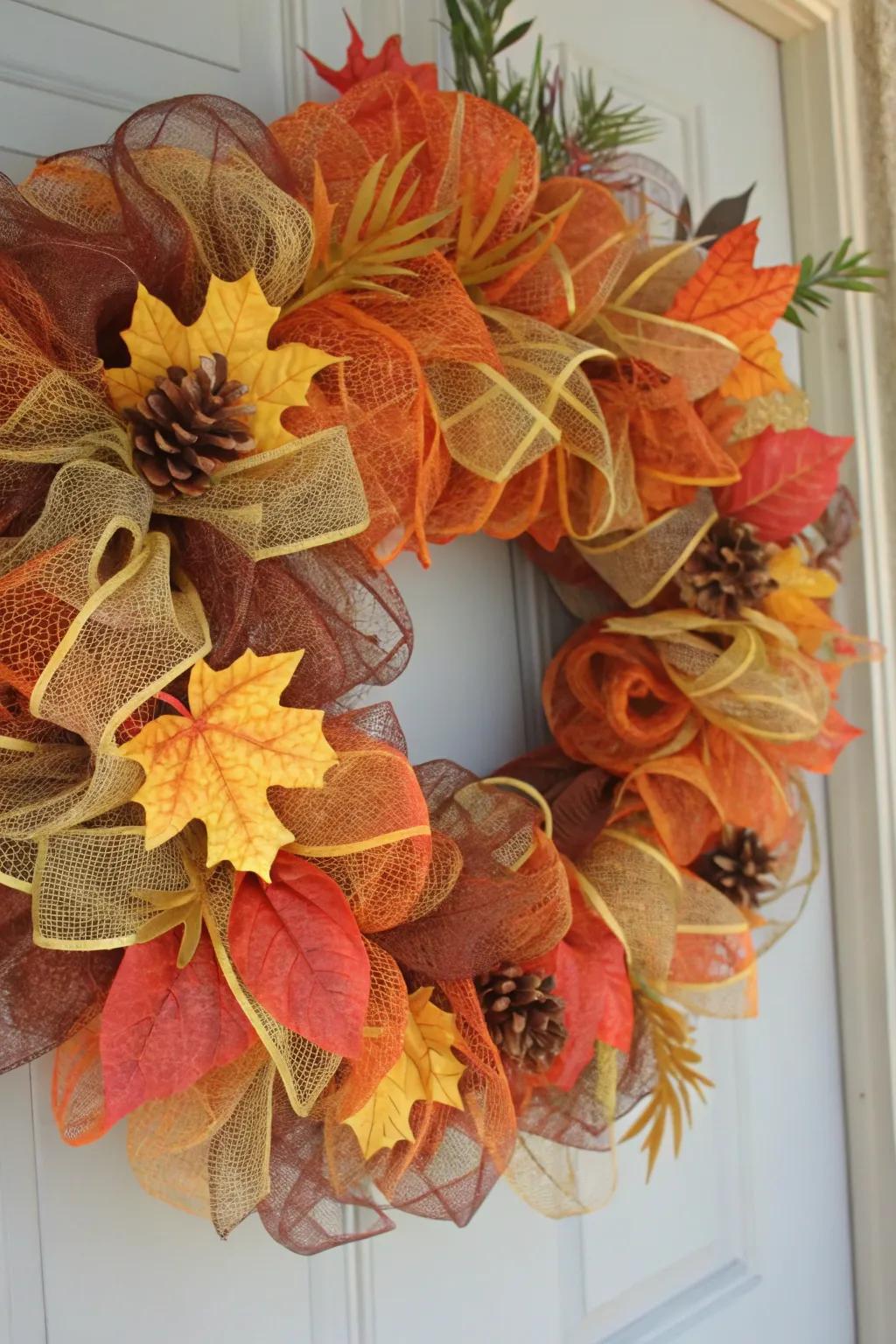 A classic autumn color wreath with deco mesh and fall leaves.