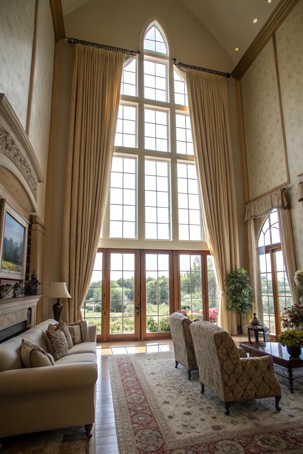 Tall curtains draw the eye upwards and add a sophisticated touch to high-ceilinged rooms.