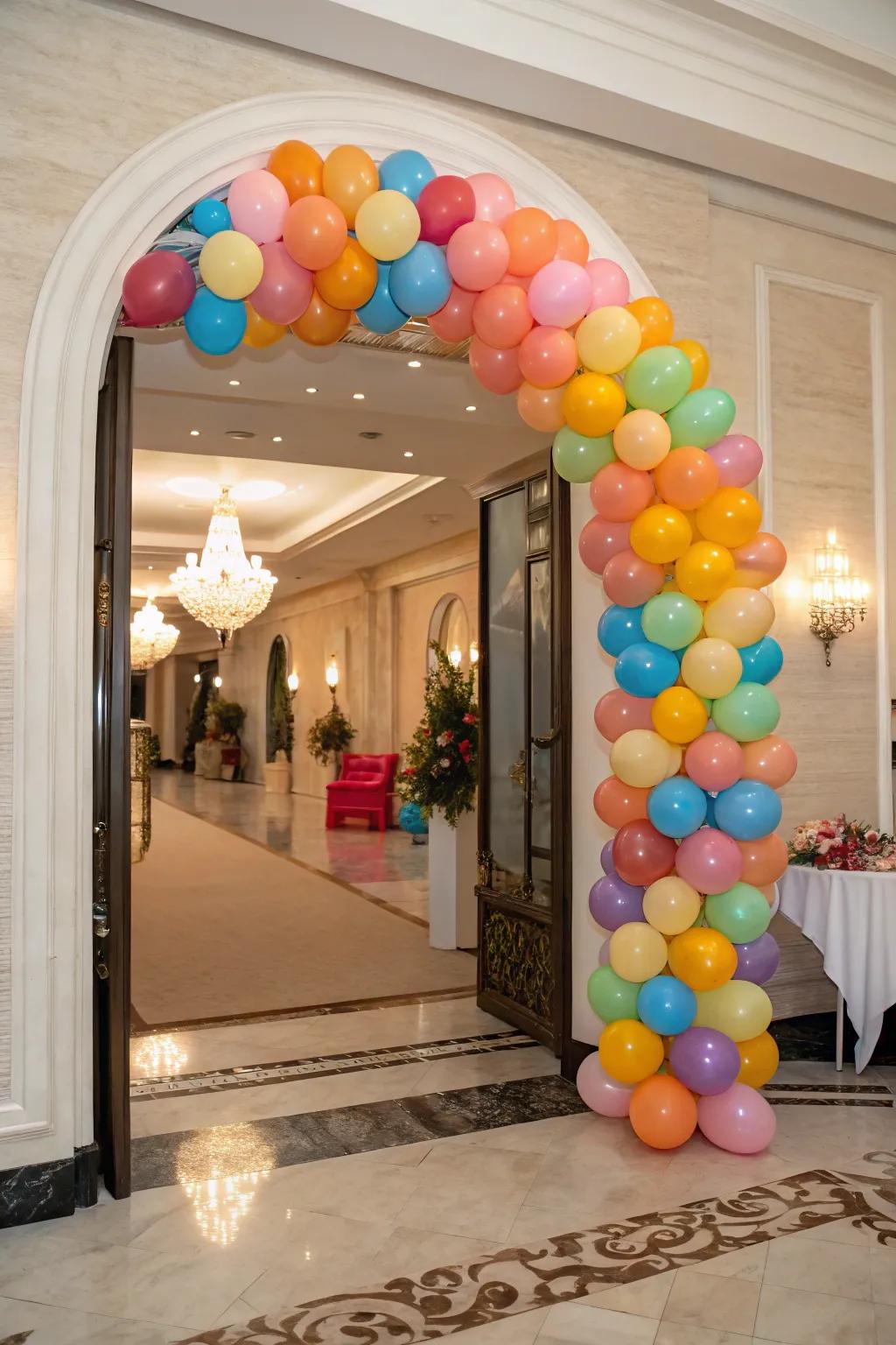 A vibrant balloon arch adds a beautiful touch to an elegant entrance, blending various sizes and hues for a lively impact.