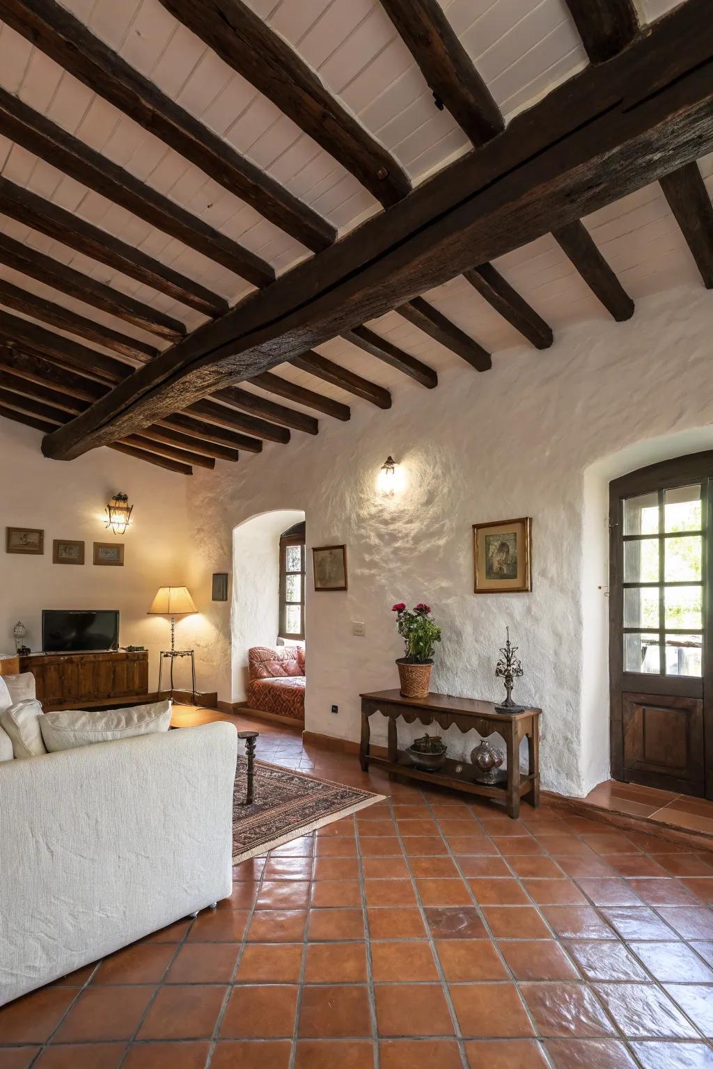 Exposed wooden beams contribute countryside charm to this Spanish-inspired living area.