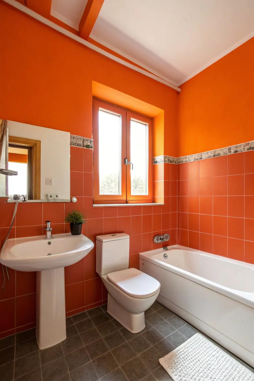 A bathroom featuring striking orange walls paired with understated white fixtures.