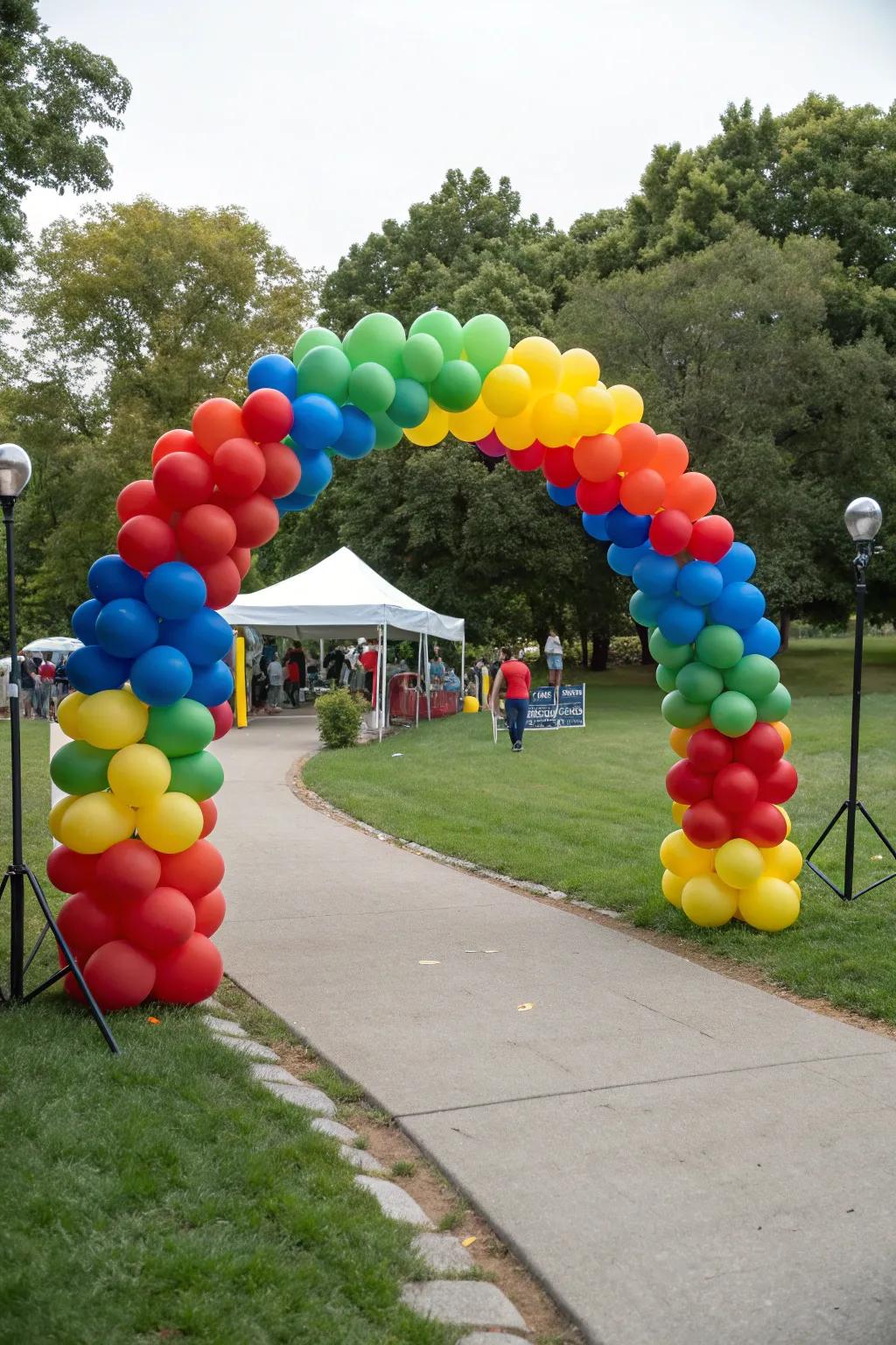 A vibrant balloon arch welcomes guests to a delightful park celebration.
