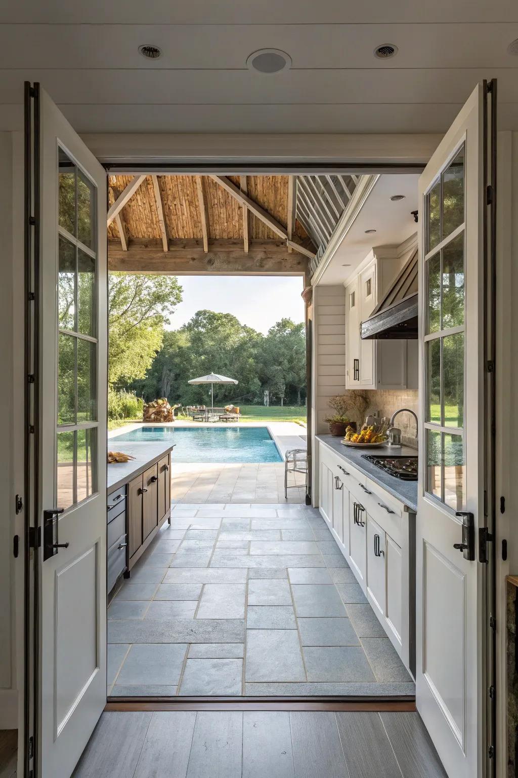 Open-air kitchen design that seamlessly connects with the pool area.