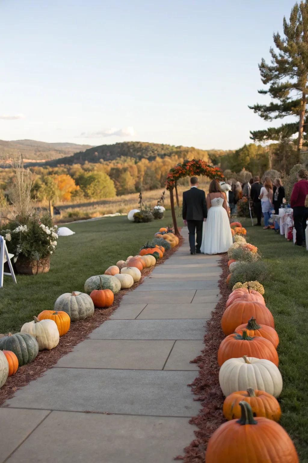 An attractive walkway decorated with squashes which leads to a wedding service.