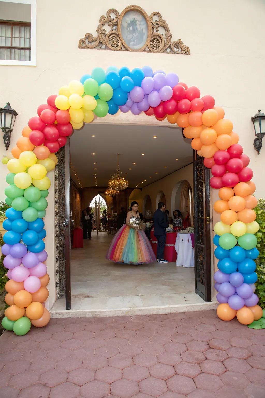 A spectacular balloon arch warmly welcomes guests to the quinceanera.