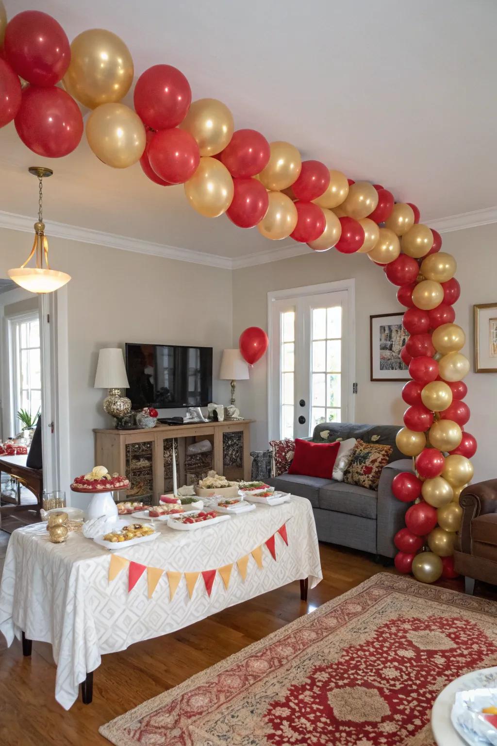 An eye-catching red and gold balloon garland marks a festive entrance.
