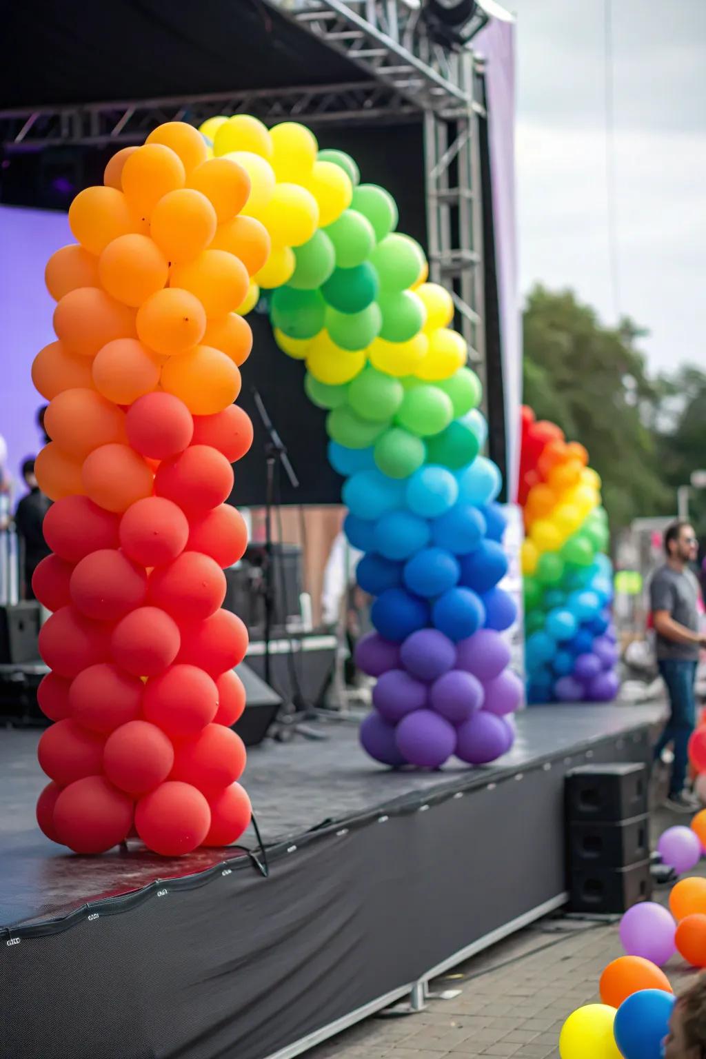 A stage showcasing a rainbow-inspired balloon decoration arrangement.