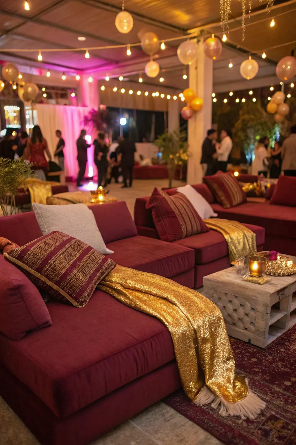 Comfortable seating spaces with deep red and gold accents encourage attendees to unwind.