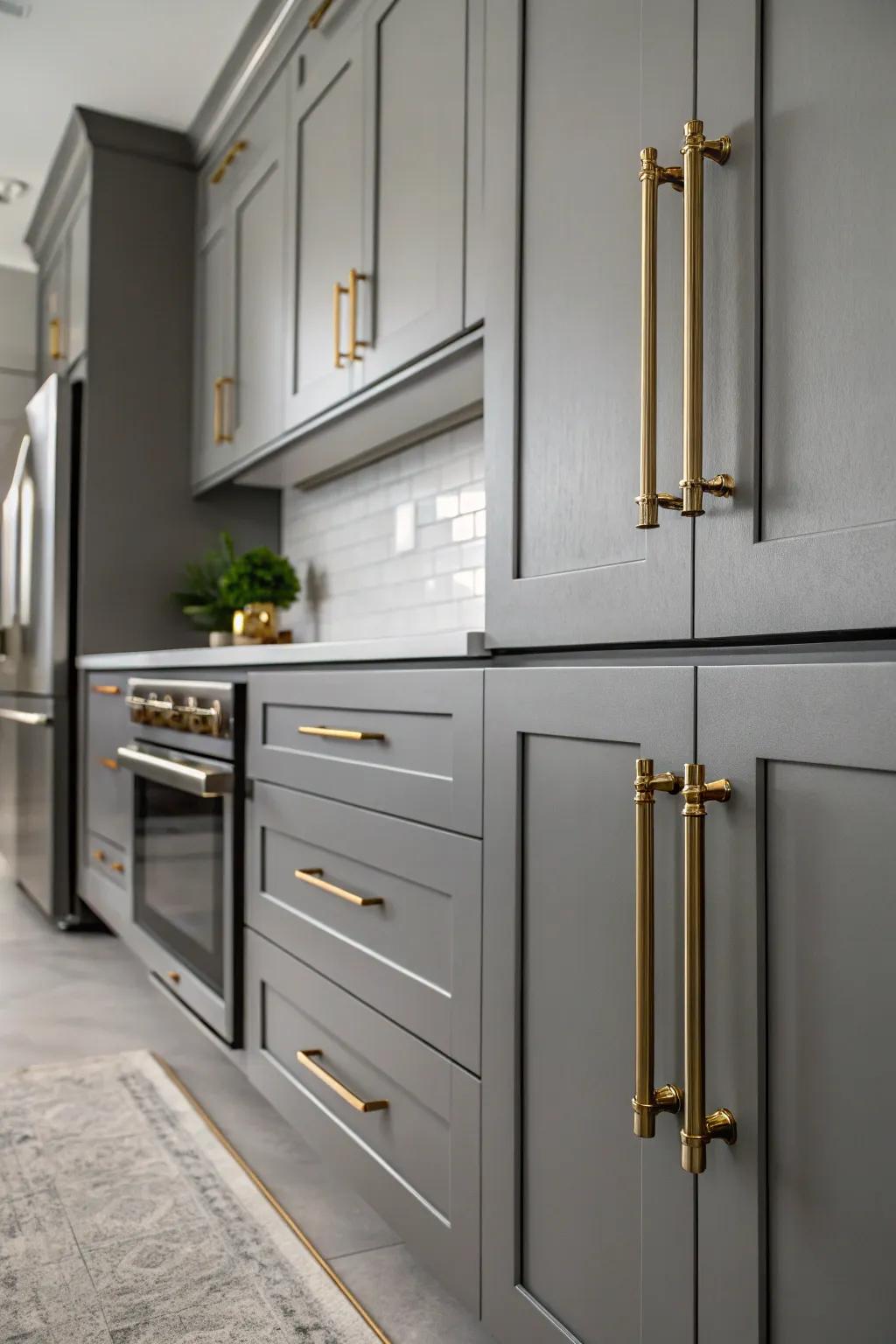 Metallic details bring a touch of glamour to a grey kitchen.