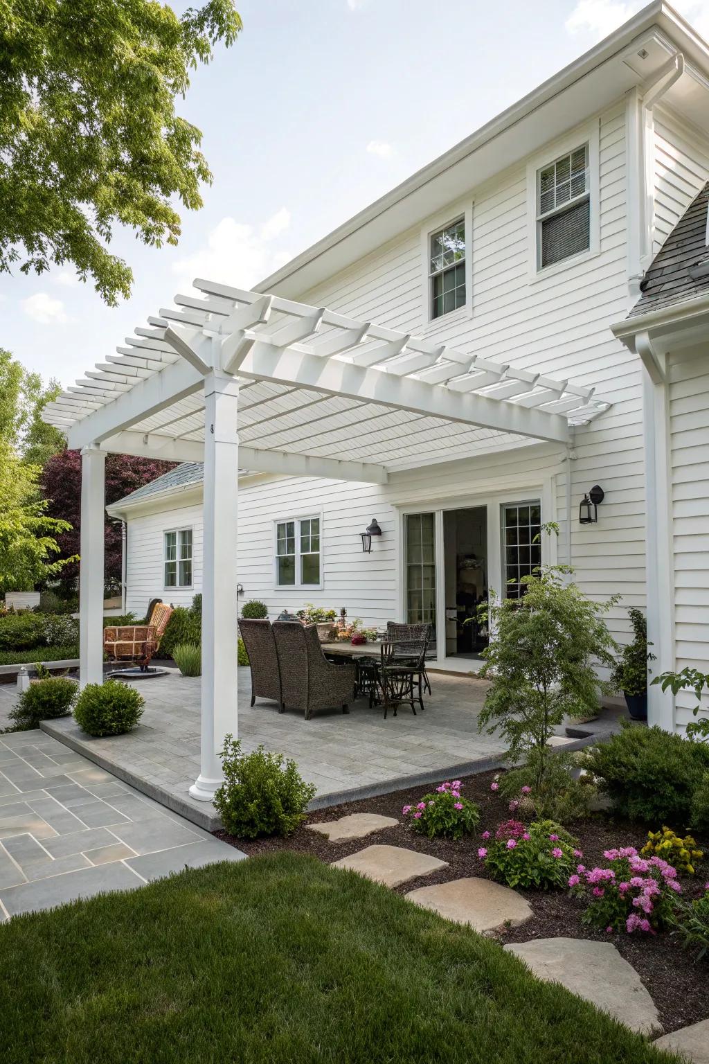 A stylish white pergola providing shade and charm to the outdoor area.