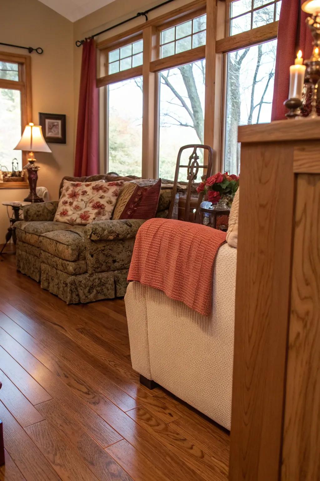 Welcoming living room with warm red oak flooring.