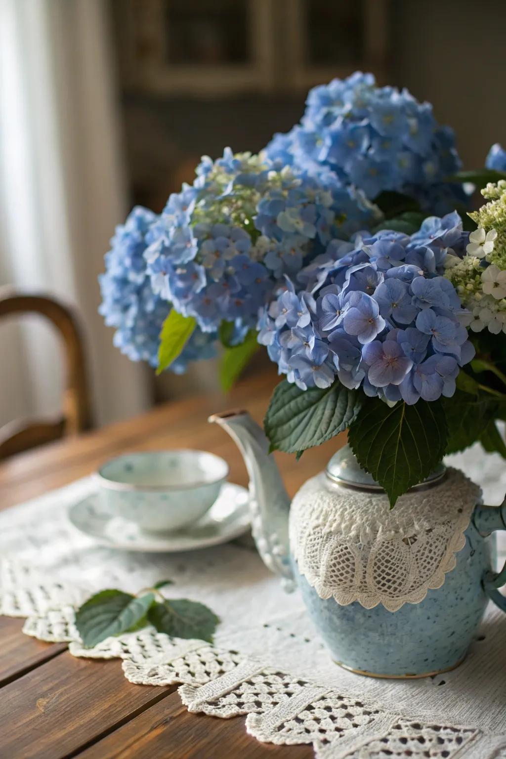 A vintage teapot makes a charming vessel for blue hydrangeas.