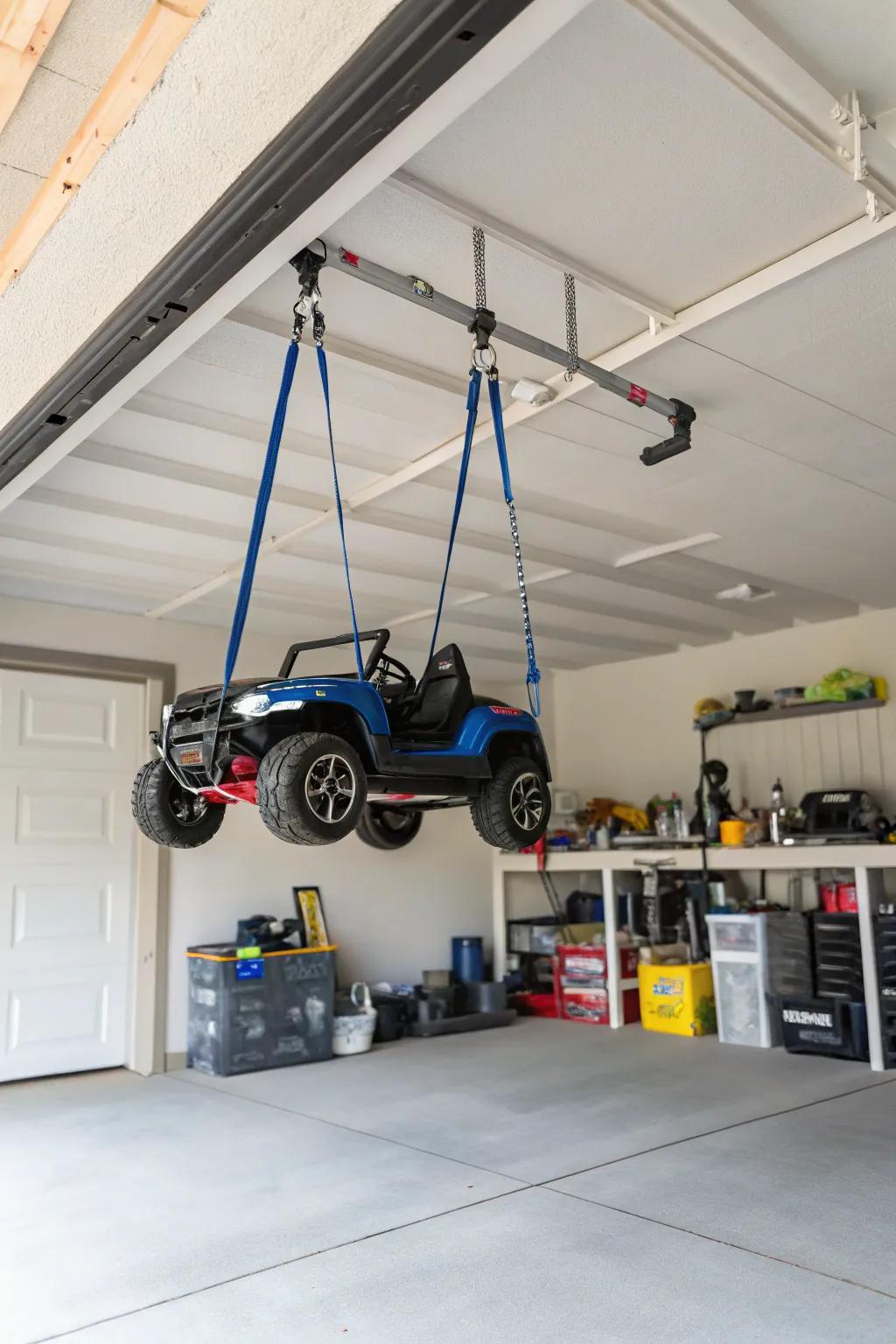Suspending straps hanging electric ride-on cars to free up floor space.