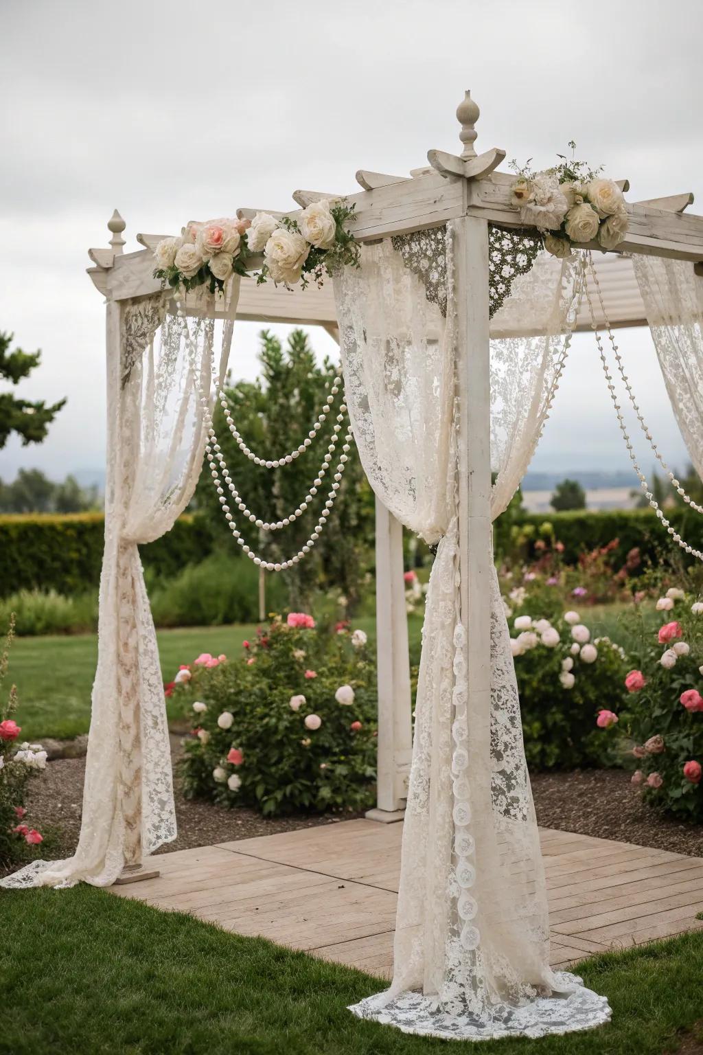 A vintage glam square arch using lace and pearls.