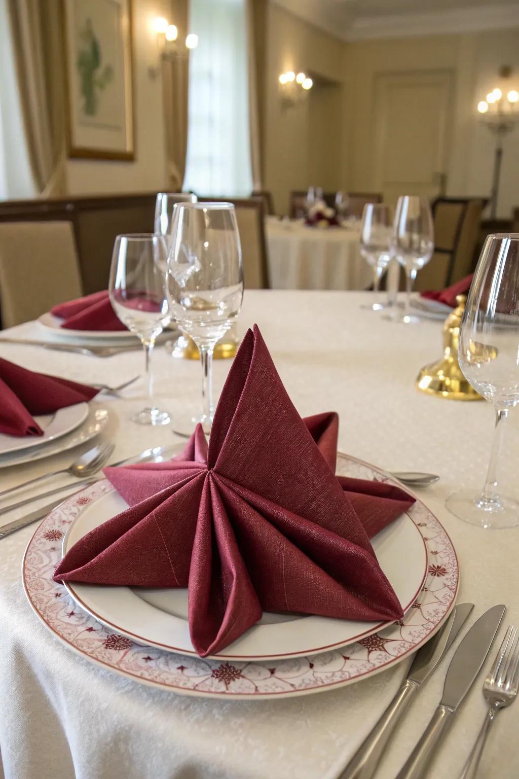 The eight-pointed star napkin fold, a dazzling centerpiece.