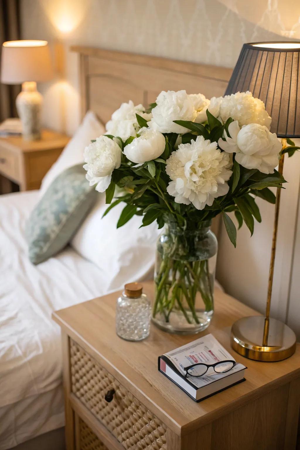 Pale peonies adding romance to a bedroom setting.