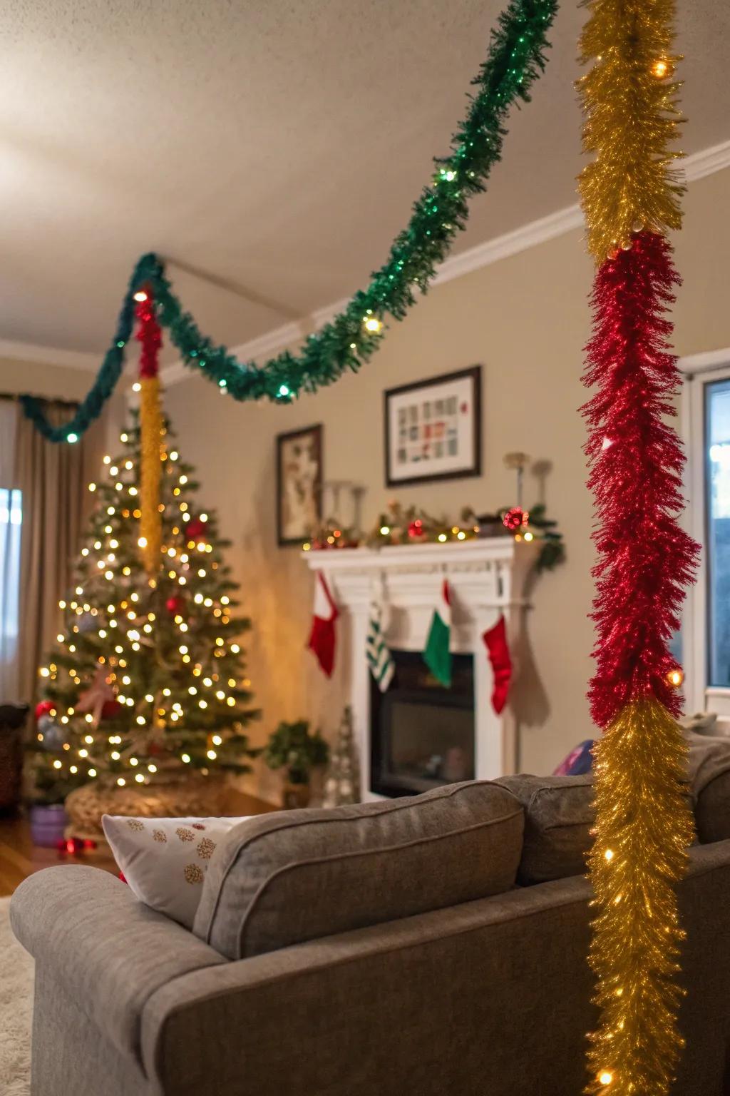 A living room decorated with colorful tinsel garland.