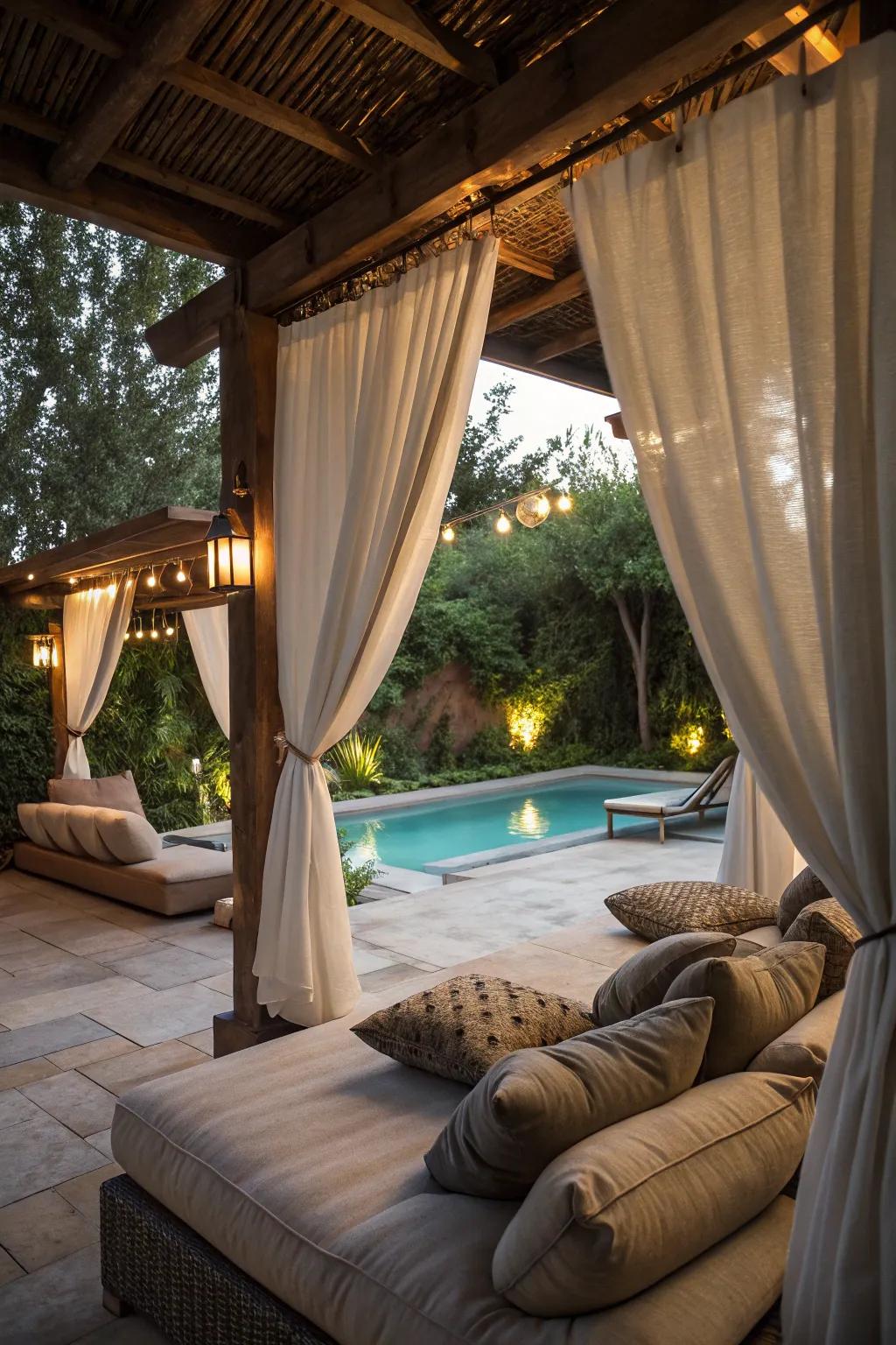 Exterior curtains fashion a private, cozy nook.