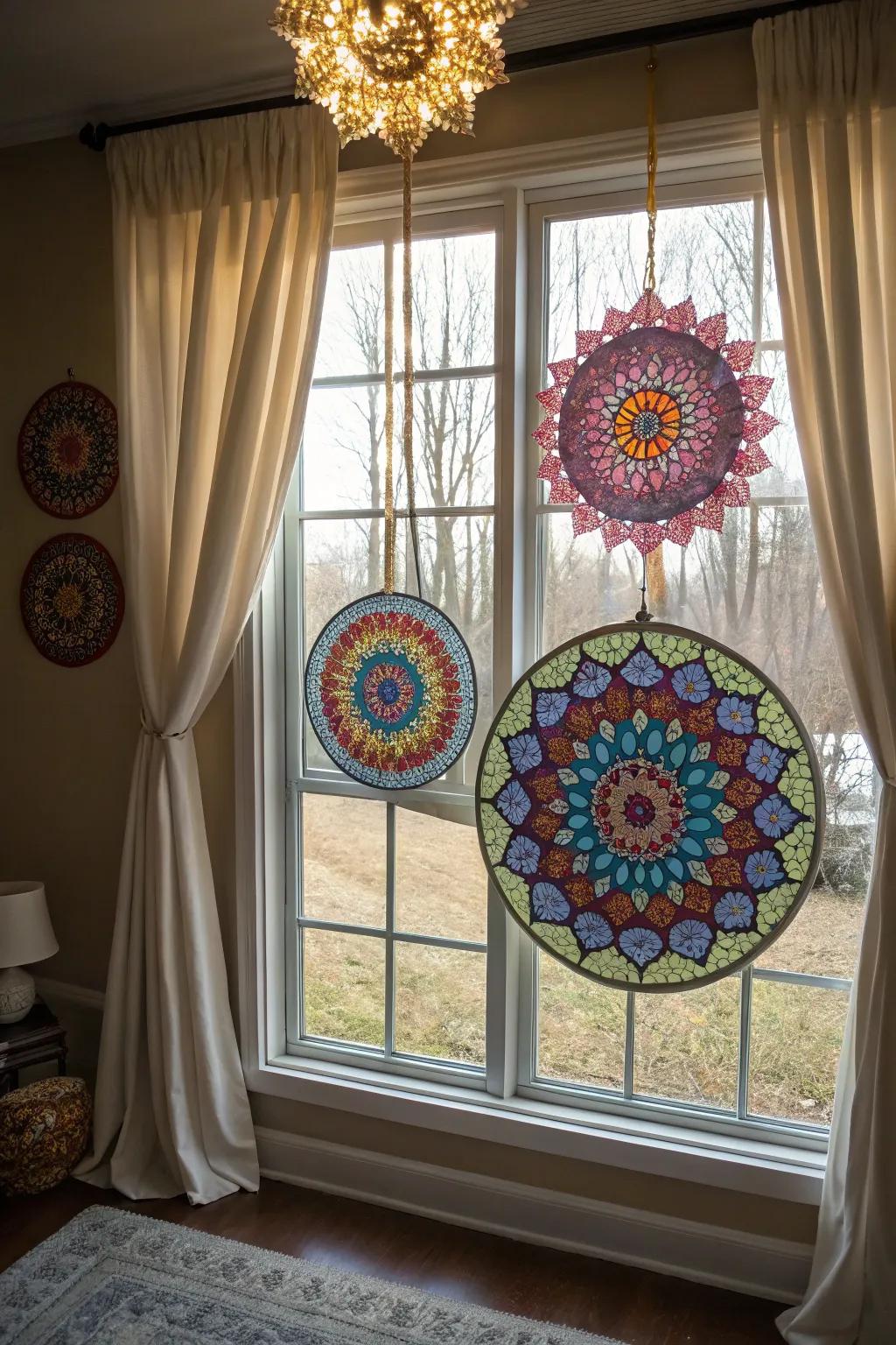 Sacred geometry sun catchers showing colorful patterns from a window.