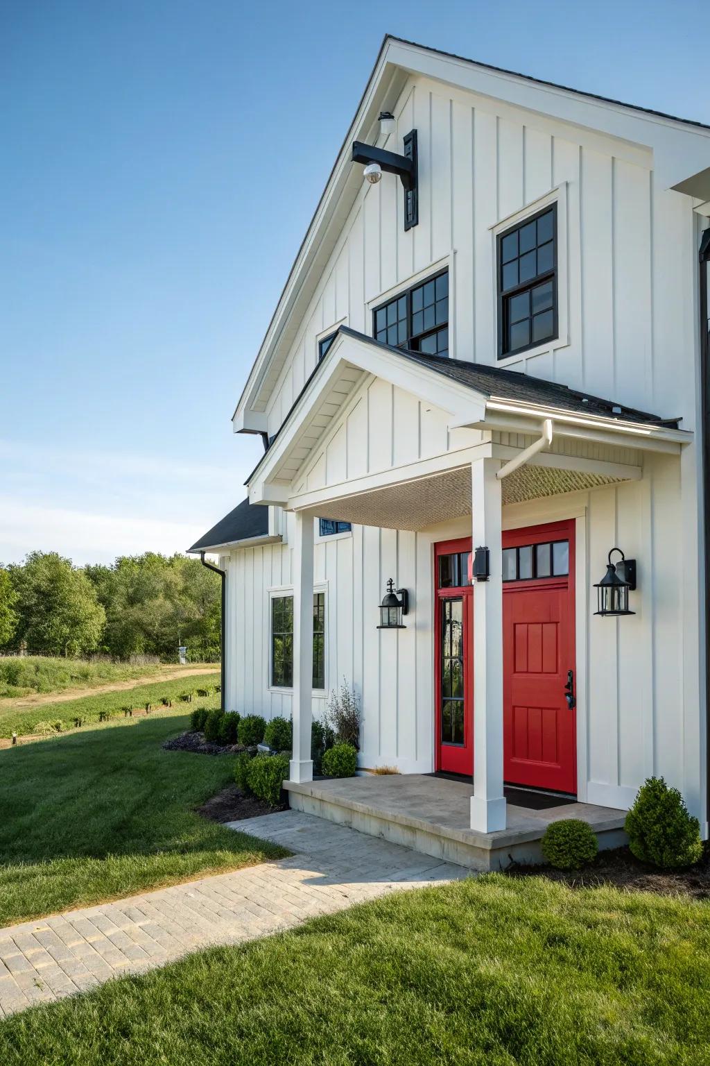 Modern farmhouse with a red door, blending tradition with modernity.