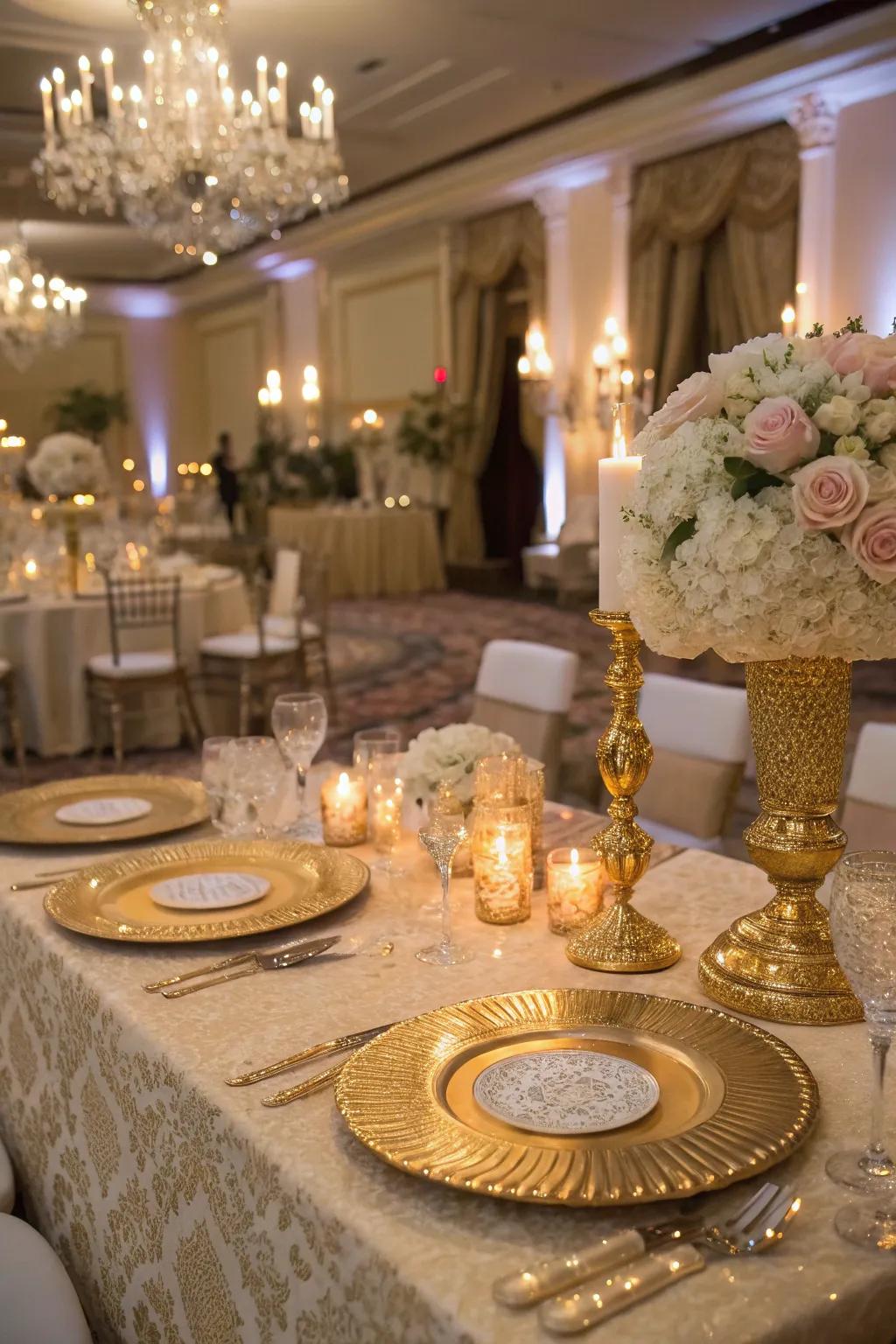 A glamorous sweetheart table showcasing gold accents and sparkling details.