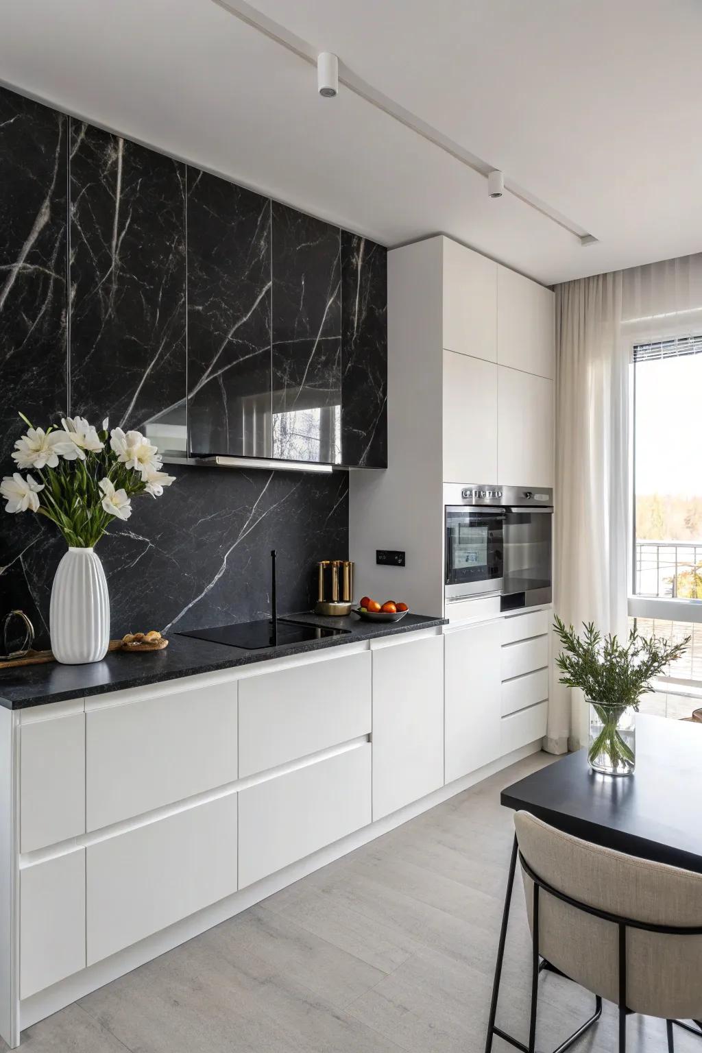 A kitchen with a luxurious black marble backsplash and minimalist design elements.