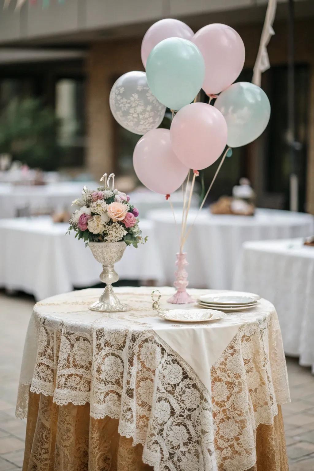 Lace and soft balloons bring vintage elegance.