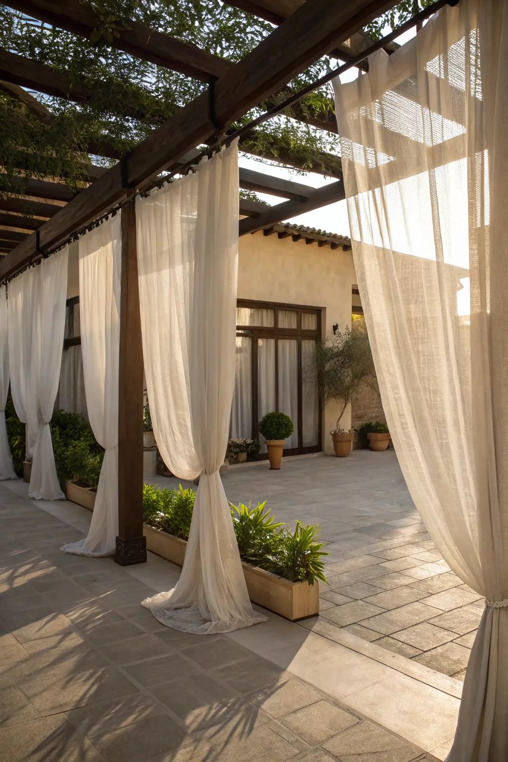 Shade drapes add sophistication and privacy to the courtyard.