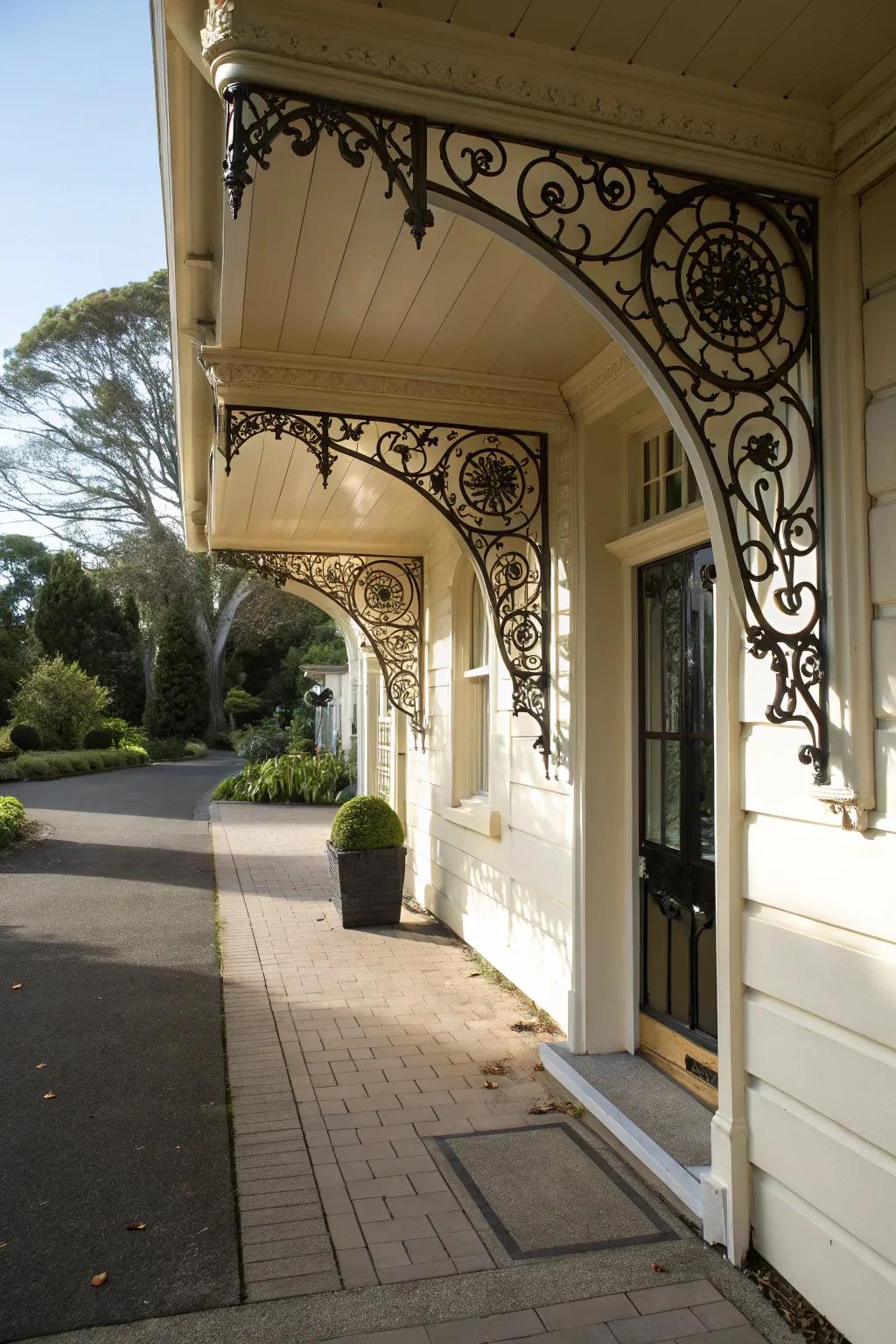 An entrance with decorated supports holding up an awning.