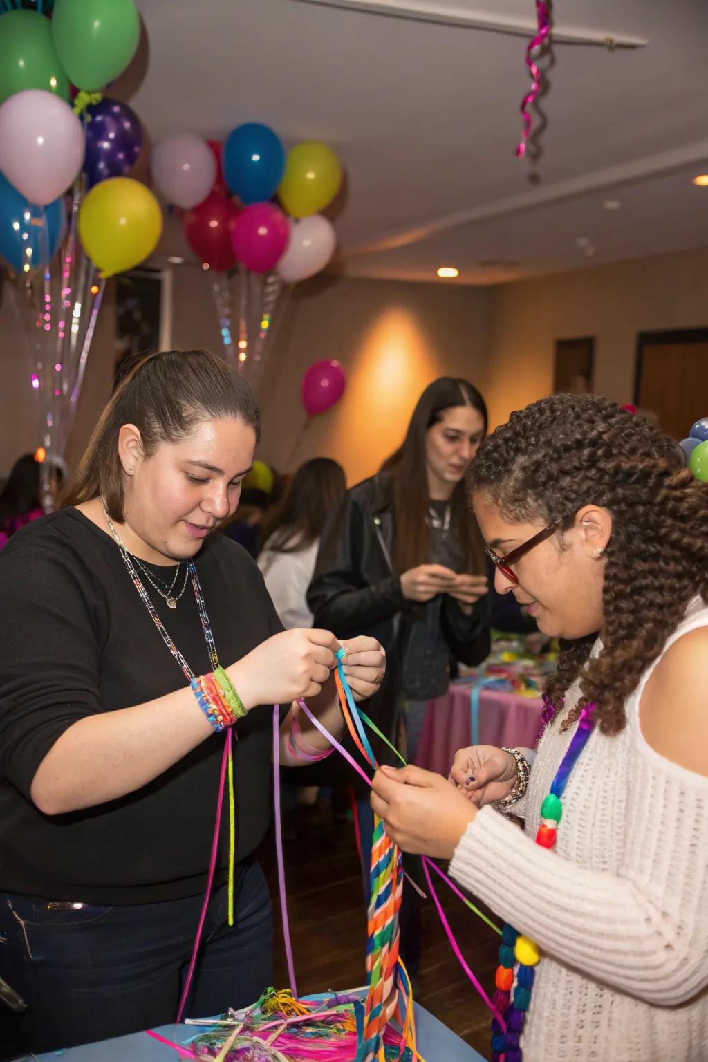 Attendees crafting spectrum corded bands as party mementos.
