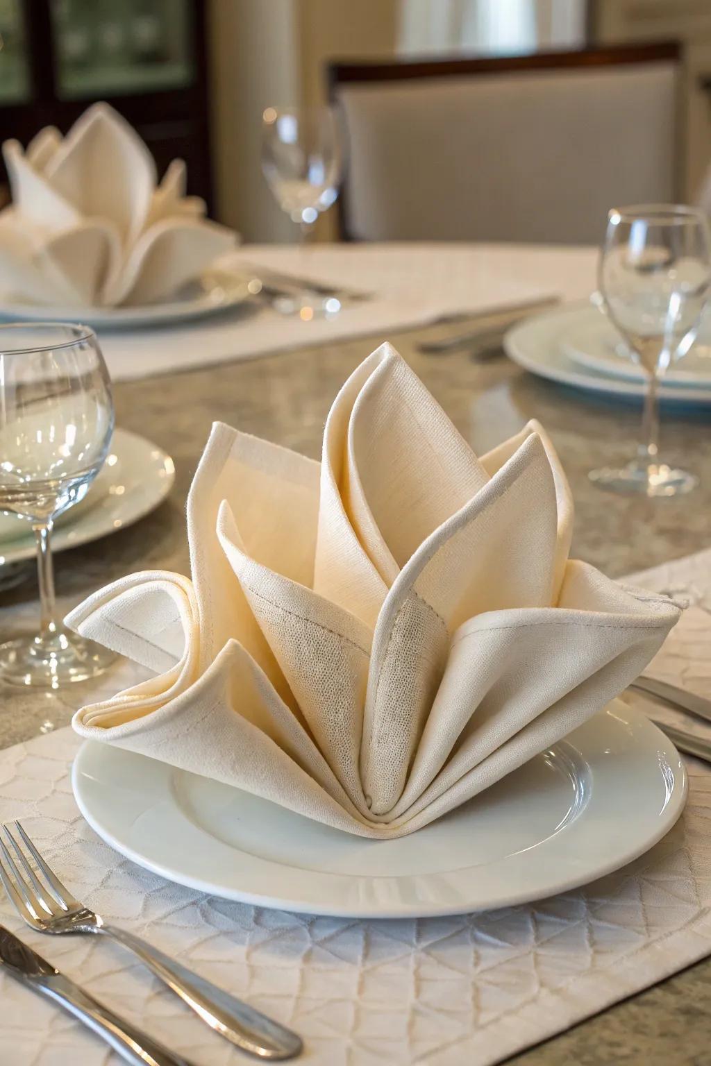 The atrium lily napkin fold, simple elegance at its best.