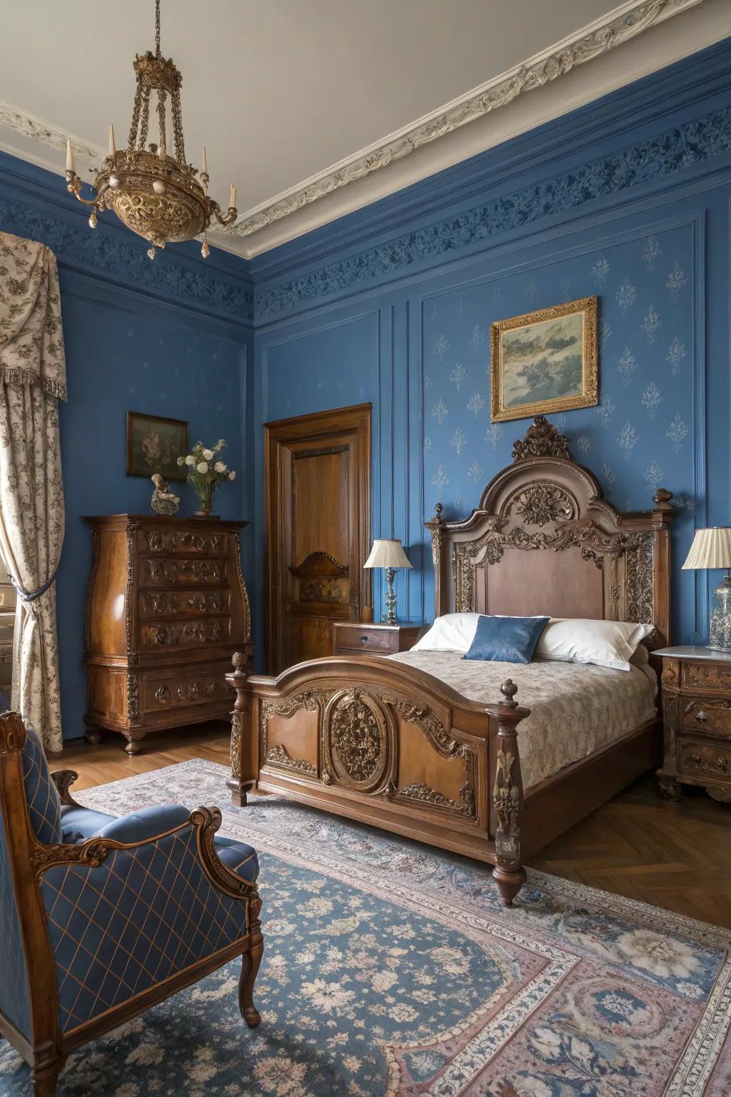 Antique furniture adds a royal charm to the modern blue bedroom.
