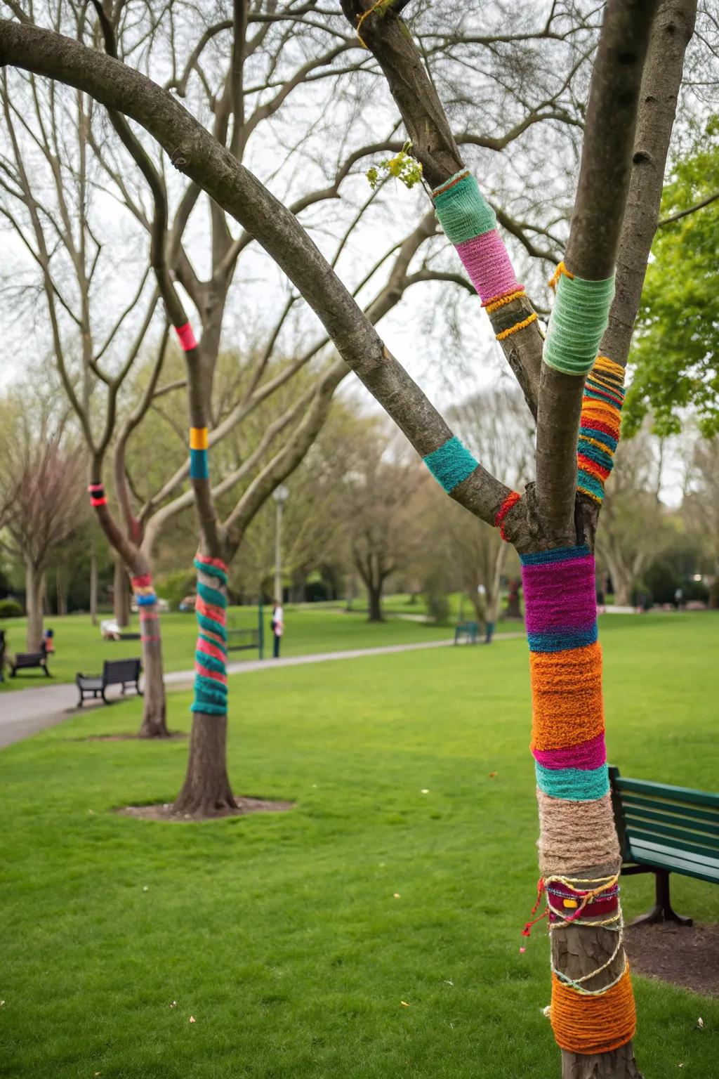 Yarn-adorned branches provide artistic flair and inject color into park decor.