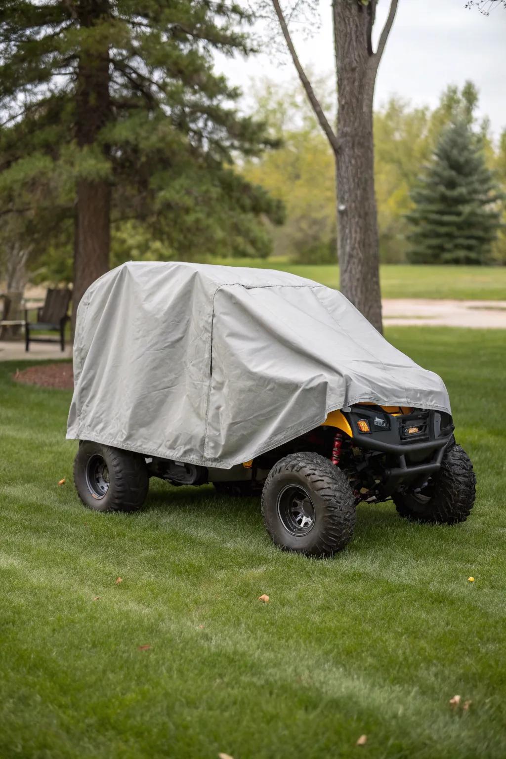 Custom-fit covers protecting outdoor-stored electric ride-on cars.