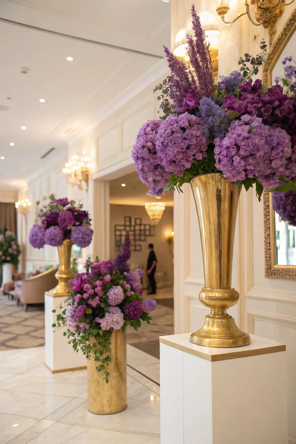 Purple flowers in gold vases bring nature indoors in a chic way.