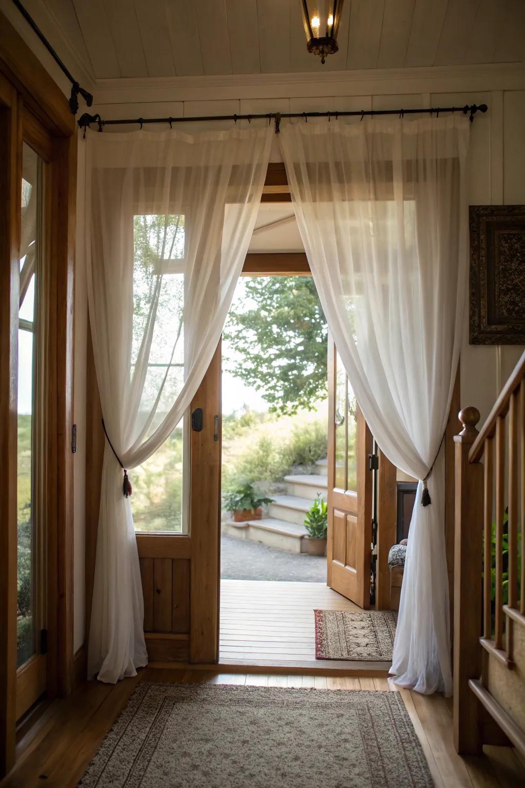 Sheer curtains maximize natural light, making the entryway feel bright and airy.