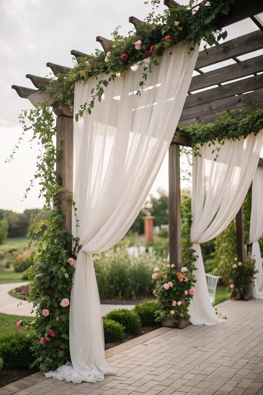 The pergola is made more romantic and private by the use of curtains.