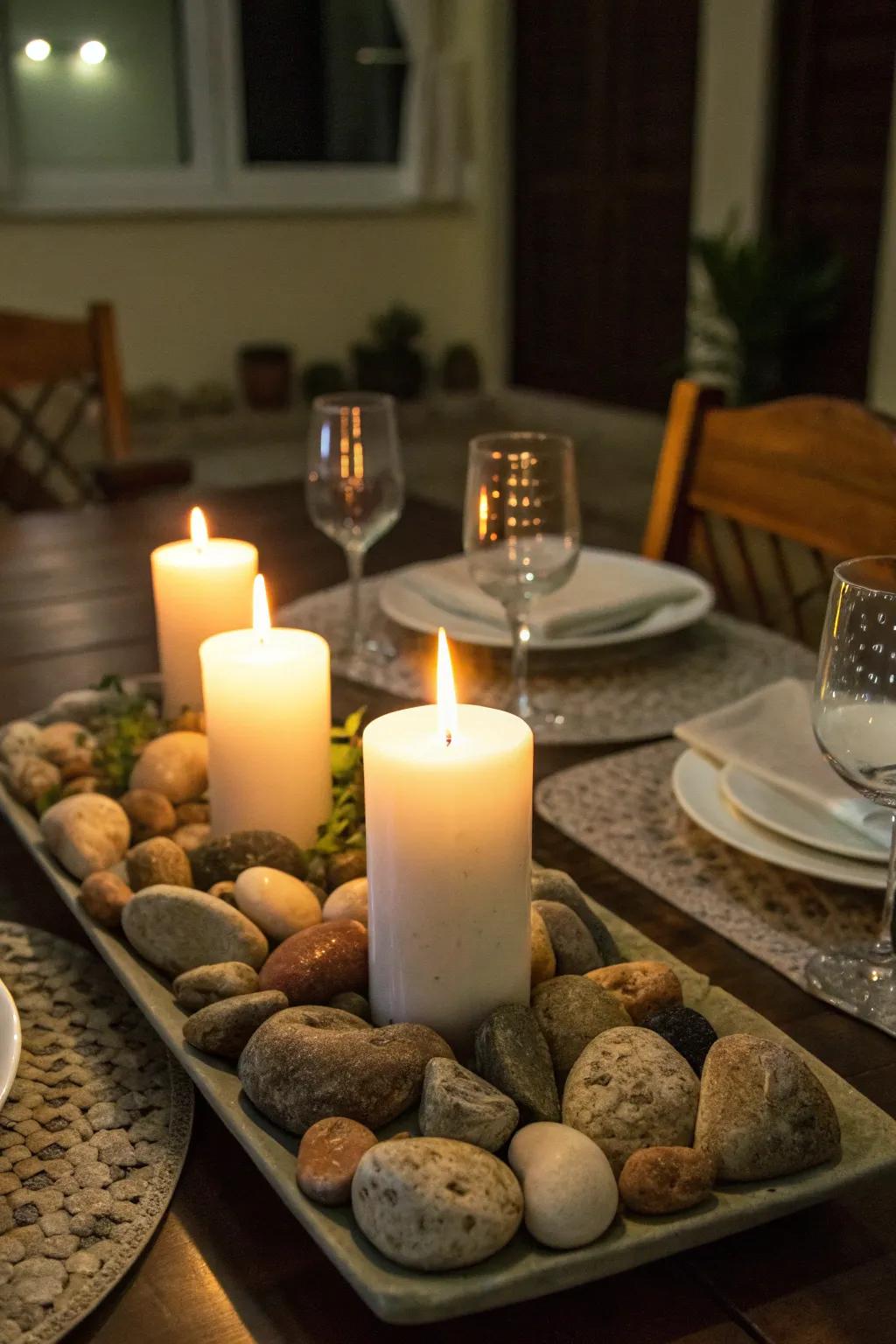 Wax lights and stones adding warmth to a dining setup