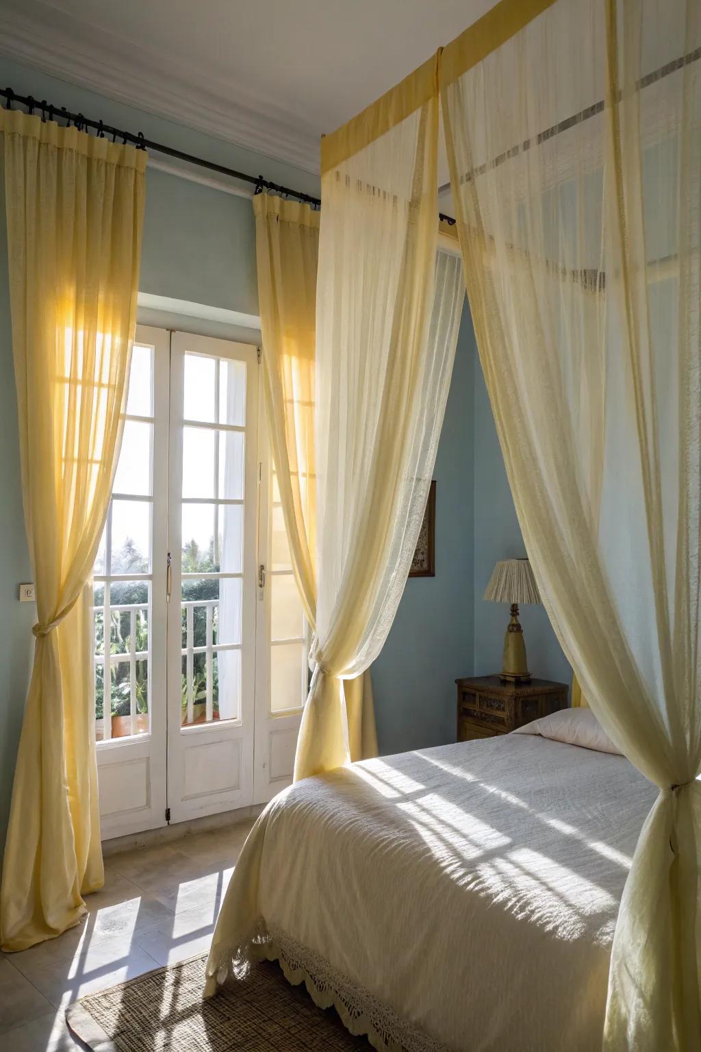 Sheer yellow window coverings add a romantic and dreamy ambiance to the bedroom.