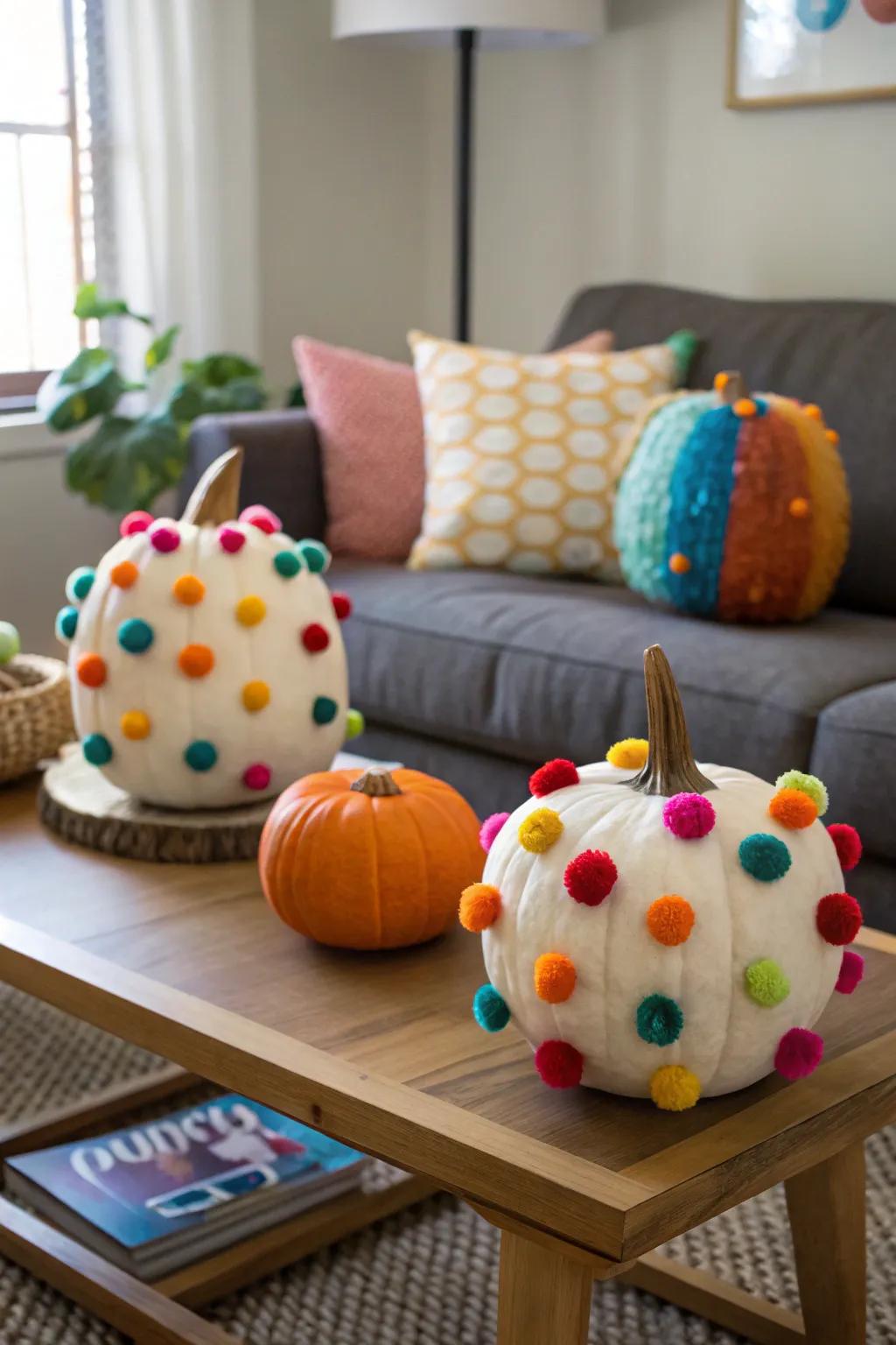Pumpkins decorated with fuzzy pom-poms.