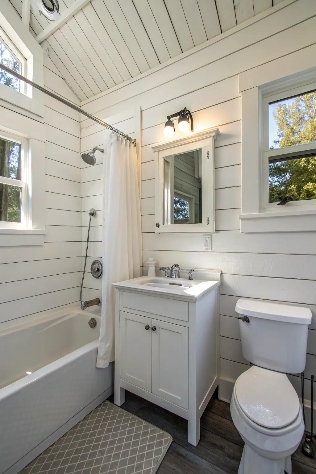 A small bathroom displaying white planks for added charm.
