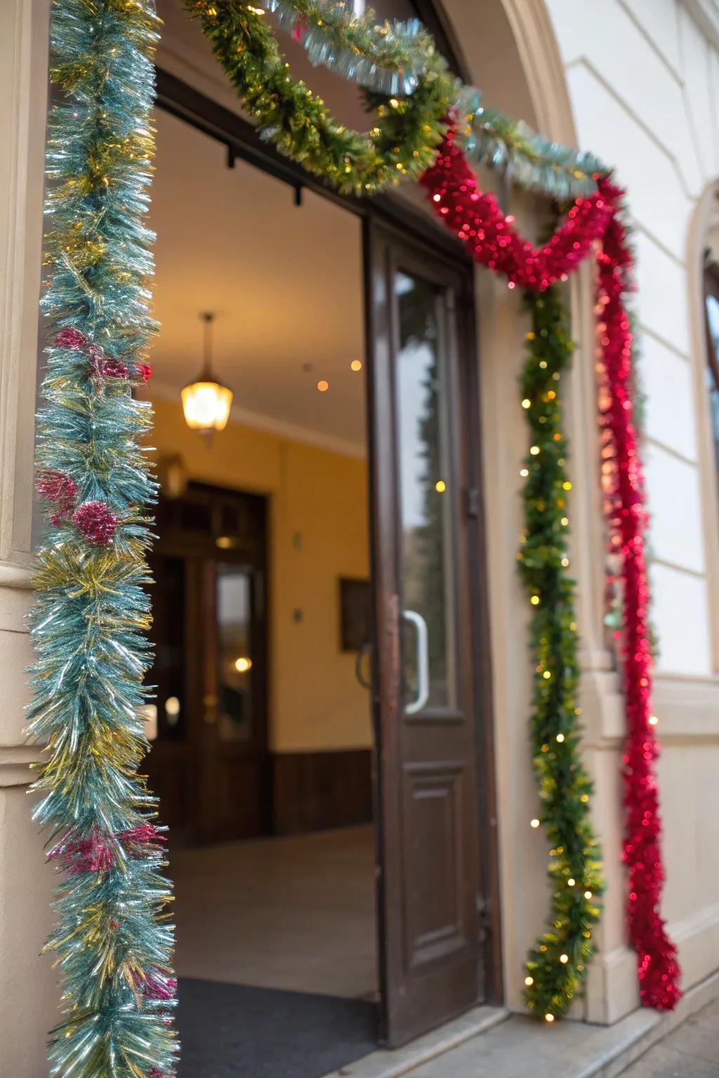 A doorway adorned with cascading tinsel garland swags.