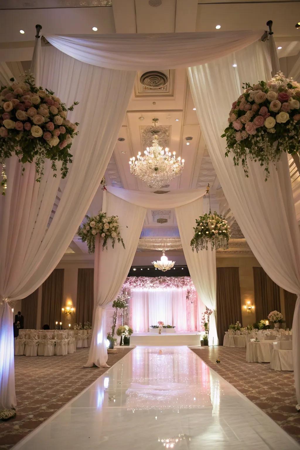 Create an unforgettable experience with drapery and drifting flowers.