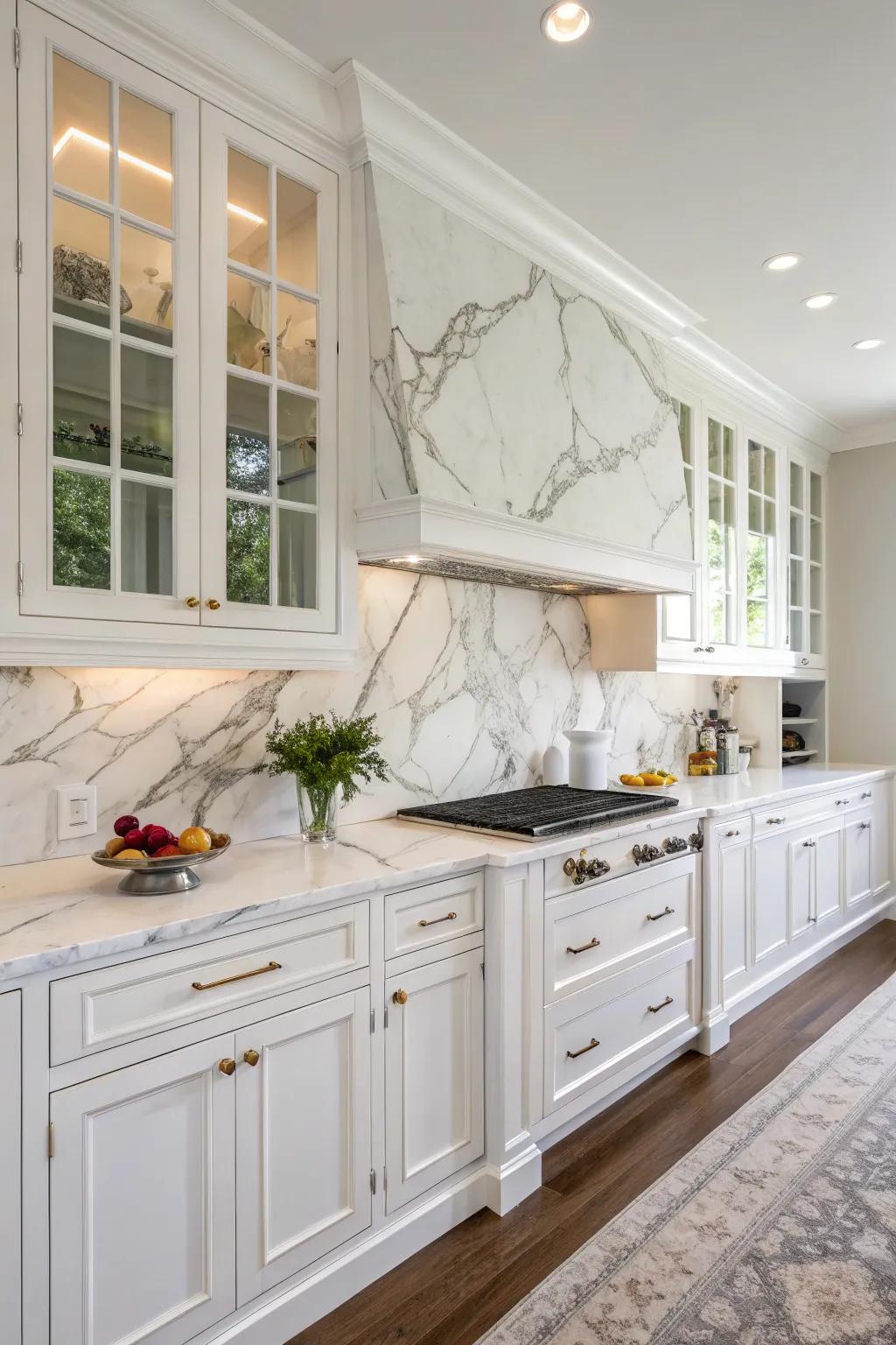 Marble backsplashes create an aura of sophistication in this white kitchen.