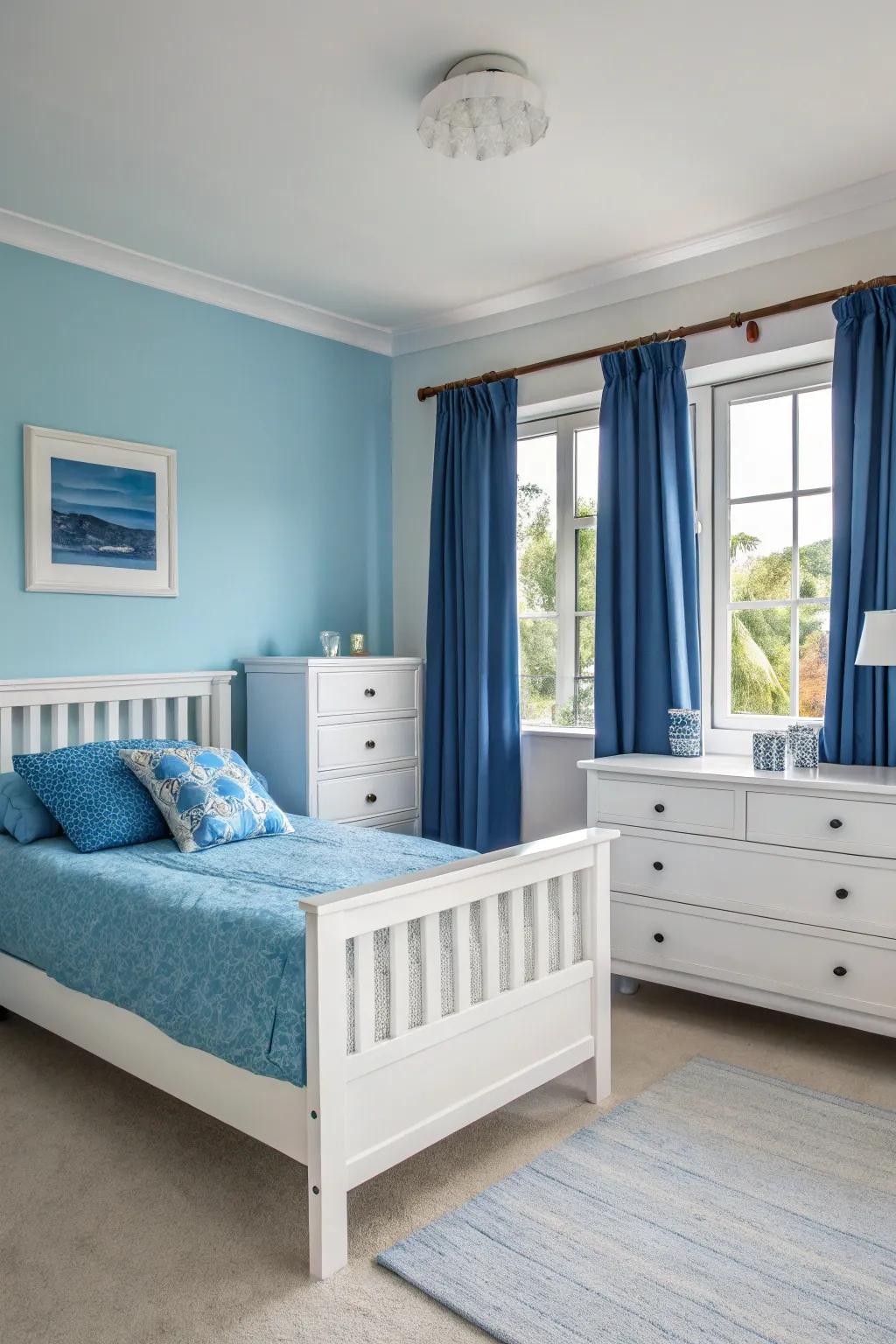 Refined ivory furniture complements the gentle blue hues in this bedroom.