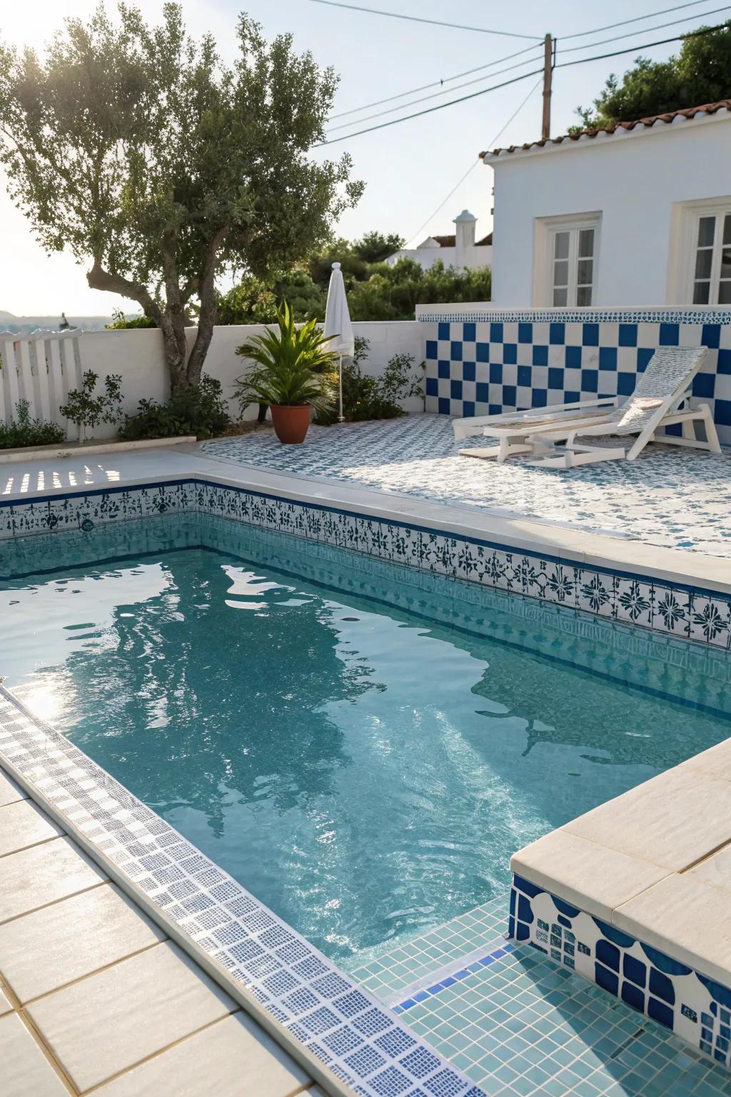 Aqua and white tiles morph your pool into a serene ocean paradise.