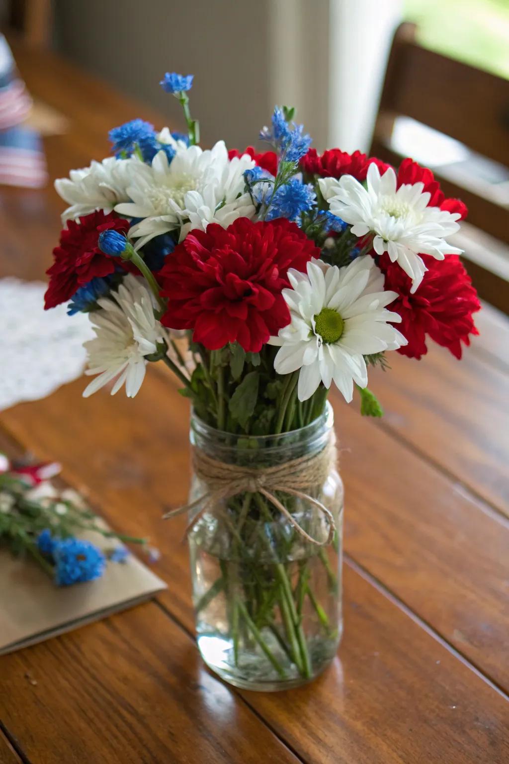Patriotic flowers displayed simply inside a canning jar setup.
